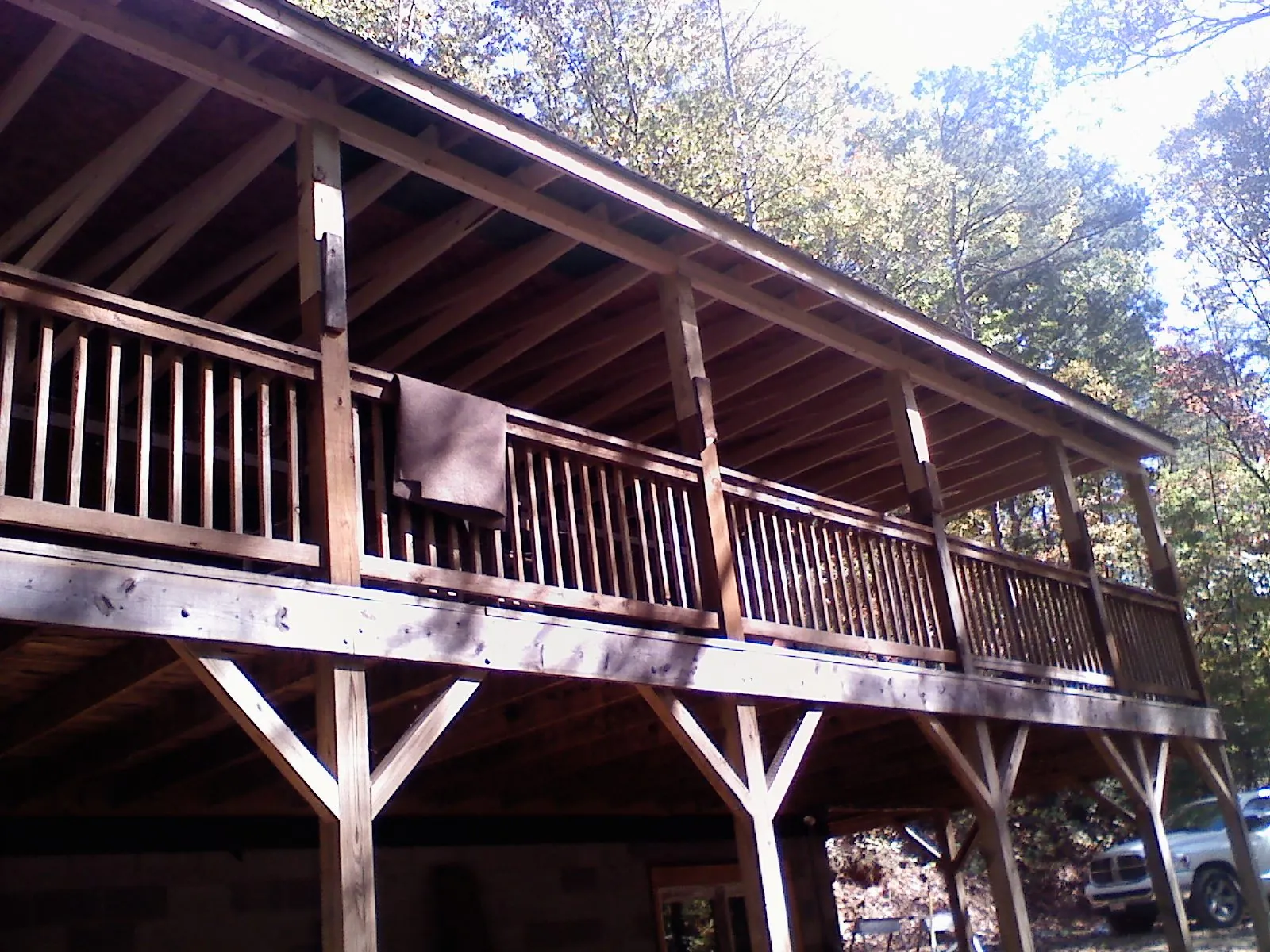 Timber framing under a new elevated porch and deck — Roof Leak Repair in New Buffalo by Roofing Brothers